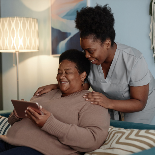 smiling-black-senior-woman-and-female-caregiver_ Live-in Care